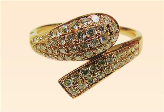 Snake-like gold and diamond ring image
