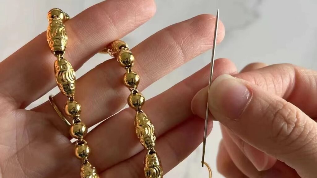 scratching gold jewelry with a needle pic